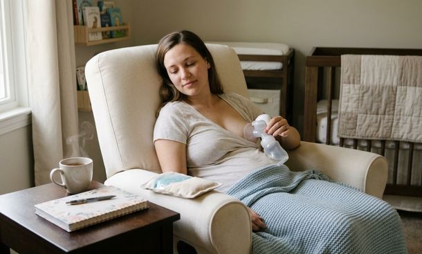 Mother relaxing with breast pump